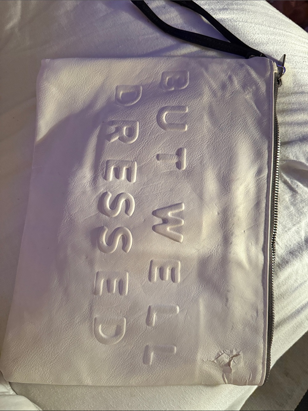 White Embossed 'But We’ll Dress Ed' Zip Pouch